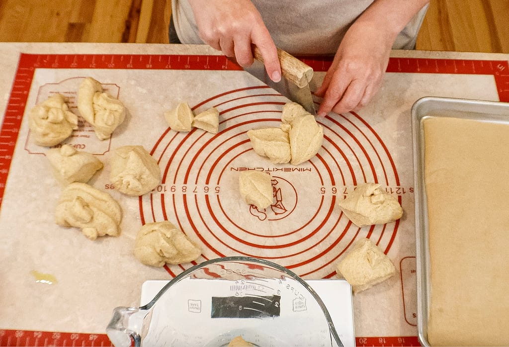 Dividing dough for garlic knots made with fresh milled flour.